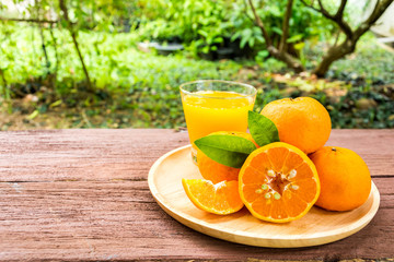Orange juice on a wooden table