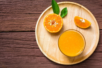 Orange juice on a wooden table