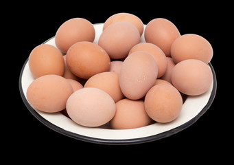 boiled eggs in a bowl on a black background