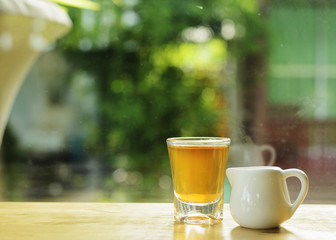 tea drinks with windows glass and bokeh lights backgrounds