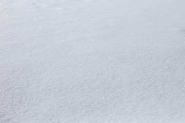 texture of snowdrifts in a soft diffused sunset light.