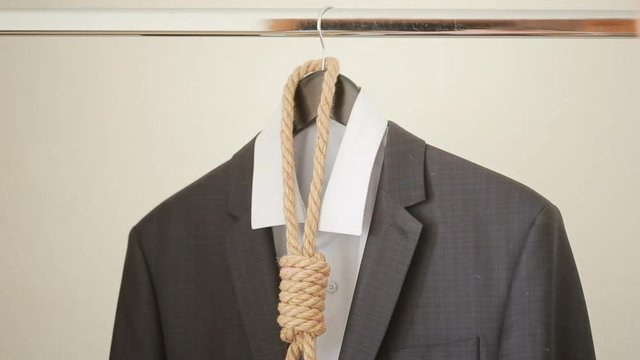 Businessman adjusting a noose rope like tie, going on not your favorite job,