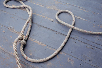 Obraz premium Hemp rope on wooden background