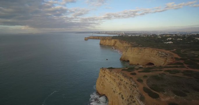 Aerial, Flying Along The Steep Cliff Line At Ferragudo, Portugal - Native Material, straight out of the cam