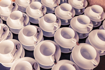 Many white cup prepared for coffee break during seminar event.