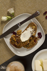 Rustic breakfast table decoration with homemade sweat bread and a cup of coffee