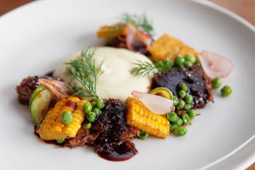 Pulled pork with grilled vegetables and potato mash