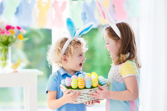 Kids with eggs basket on Easter egg hunt