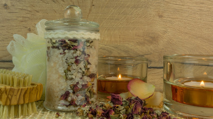 Obraz na płótnie Canvas Spa and wellness with bath salt, candles and rose blossom