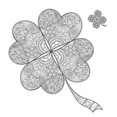 Coloring book shamrock on St. Patrick's Day.Black and white clover with four leaves. Decorated with hand draw doodle pattern. Vector sign of good luck.
