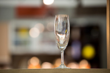 blank wine glass with burred bacground.