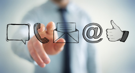 Businessman touching manuscript contact icon with his finger