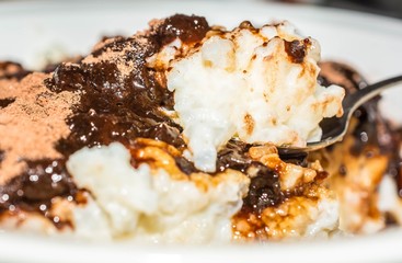 Rice milk porridge with cocoa and cherry marmalade