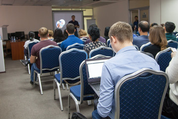 The image of a conference in a conference hall