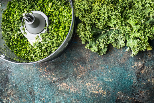 Chopped kale leaves on rustic background, top view, border