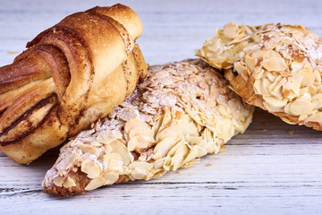 Cinnamon roll, almond croissant and almond danish pastry