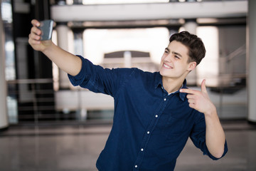 handsome young man smiling indoors