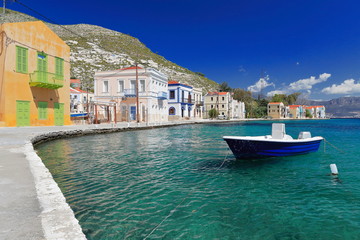 Fototapeta na wymiar Boat moored-west side main harbor-Pera Meria district. Kastellorizo-Greece. 1606