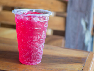 Strawberry soda juice on the table.