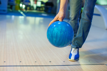 the hand throws the bowling ball