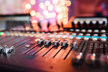 od adjusters and red buttons of a mixing console. It is used for audio signals modifications to achieve the desired output. Applied in recording studios, broadcasting, television. - obrazy, fototapety, plakaty