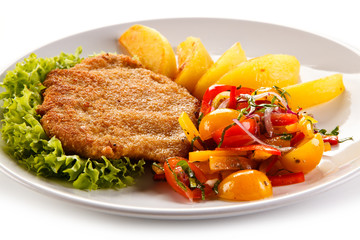 Fried pork chops and vegetable salad 
