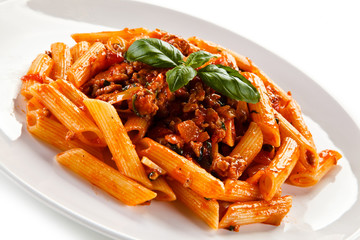 Penne with meat, tomato sauce and vegetables 