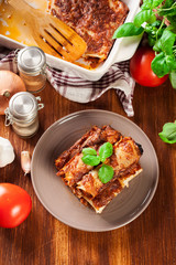 Baked cannelloni with minced meat and bechamel sauce on a plate