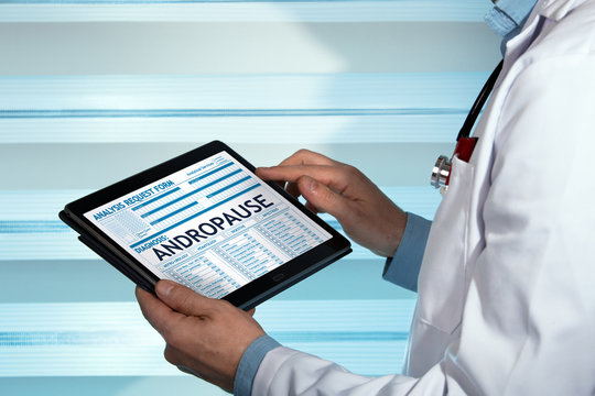 Urologist holding Tablet with a Andropause diagnosis in digital medical report / doctor with medical record digital on the tablet with text Andropause in diagnostic 