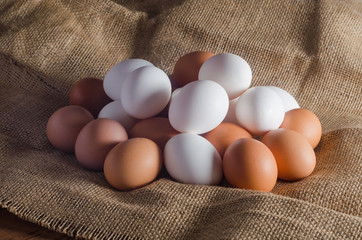 Eggs on sacking on wooden table