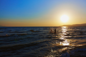 Two lovers playing in sea