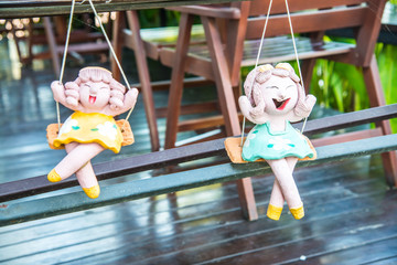 Lovely ceramic doll in park