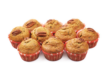 Pile of pecan nut cupcakes isolated