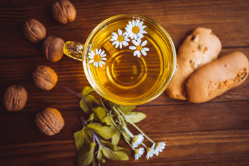 herbal tea cookies and nuts on the table