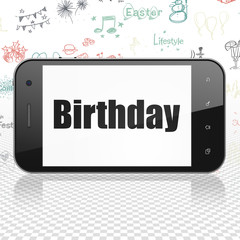 Holiday concept: Smartphone with Birthday on display