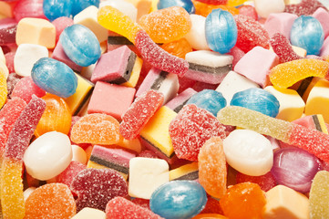 various kinds of many kid candy  candies over joyful background