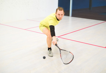 man playing squash