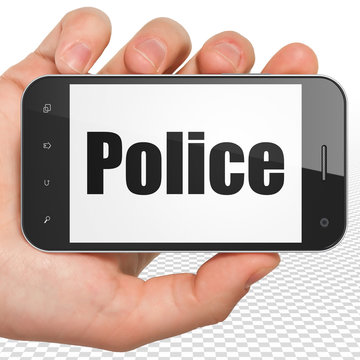 Law concept: Hand Holding Smartphone with Police on display