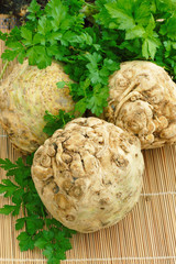 Raw Celery Roots with green leaves