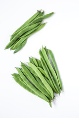 Fresh green beans on a white background