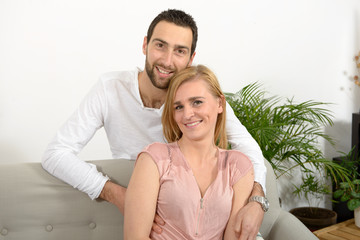 young couple resting in the sofa