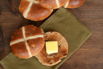 top view hot cross bun with butter