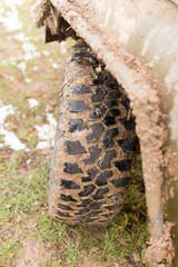 dirty tire SUV in nature