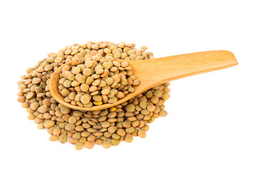 lentils in wood spoon isolated on white background