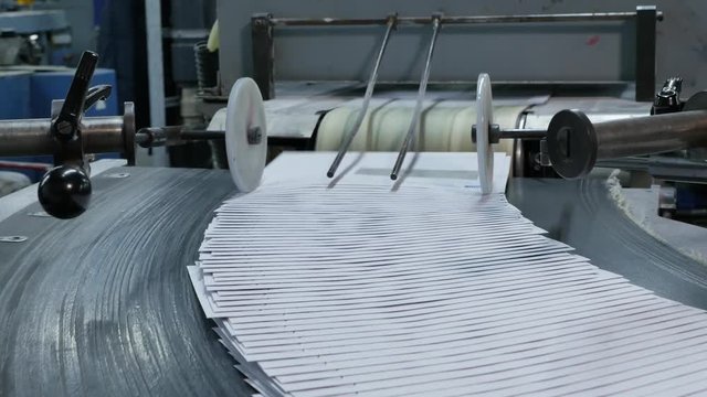Envelopes are transported on the conveyor belt in an envelope printing factory