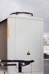 Condensing unit for air industrial conditioning system