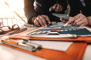 Business team meeting present.professional investor working with new startup project. Finance managers task.Digital tablet laptop computer design smart phone in morning light
