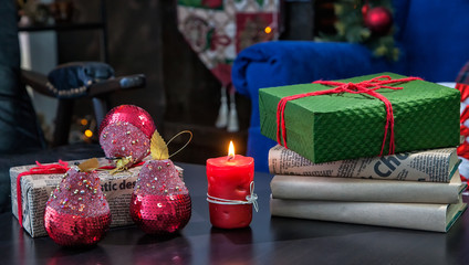Christmas gift and decorations on table close-up