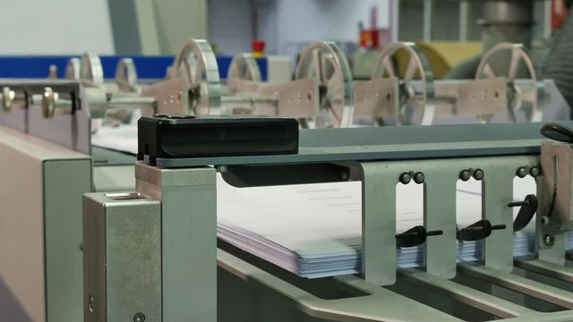 Envelopes being printed in a big factory, assembly line