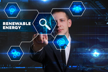 Business, Technology, Internet and network concept. Young businessman working on a virtual blackboard of the future, he sees the inscription: renewable energy